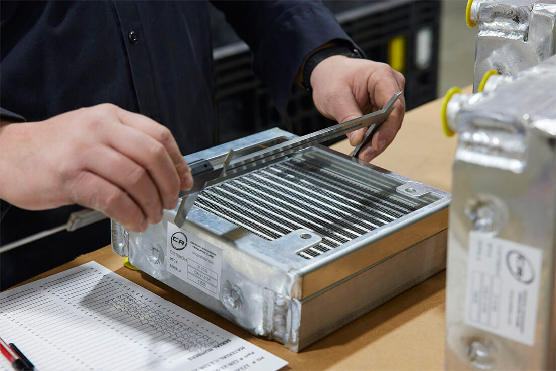 A worker measuring a part