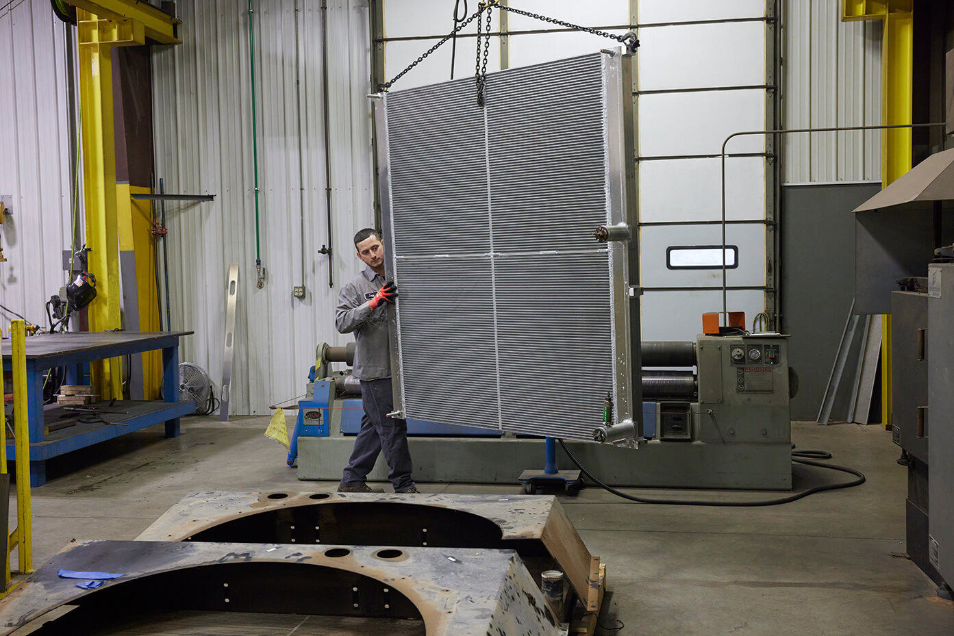 A worker guiding an air exchanger